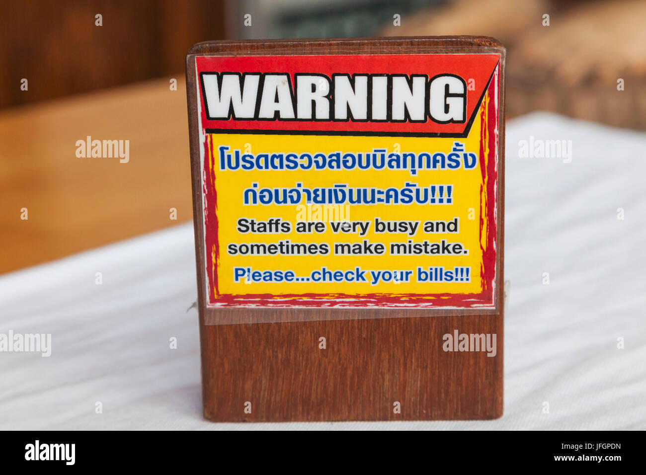 Thailand, Bangkok, Khaosan Road, Restaurant Warning Sign Asking Customers to Check Their Bill Stock Photo