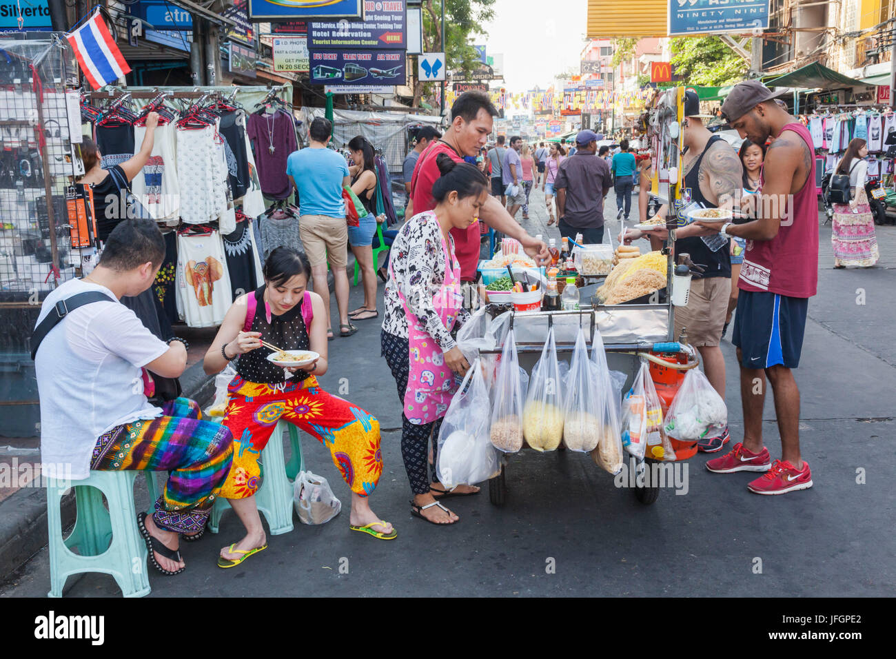 Thailand, Bangkok, Khaosan Road, Street Scene of Food Vendor's Cart and Customers Stock Photo