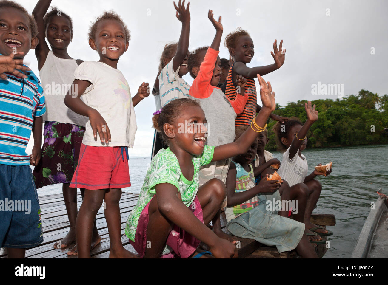 Locals of the island Telina greet visitor, Marovo lagoon, the Solomon Islands Stock Photo