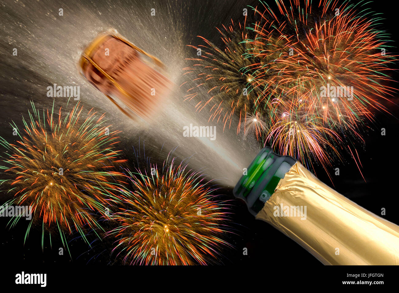 Fireworks and champagne bottle with belting cork Stock Photo