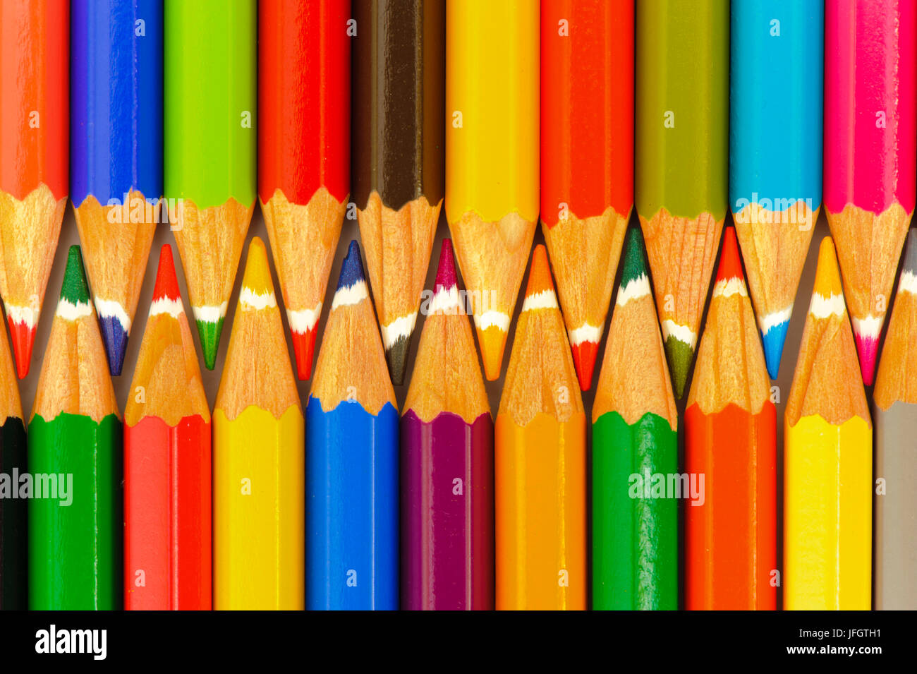 Coloured pencils form a team Stock Photo