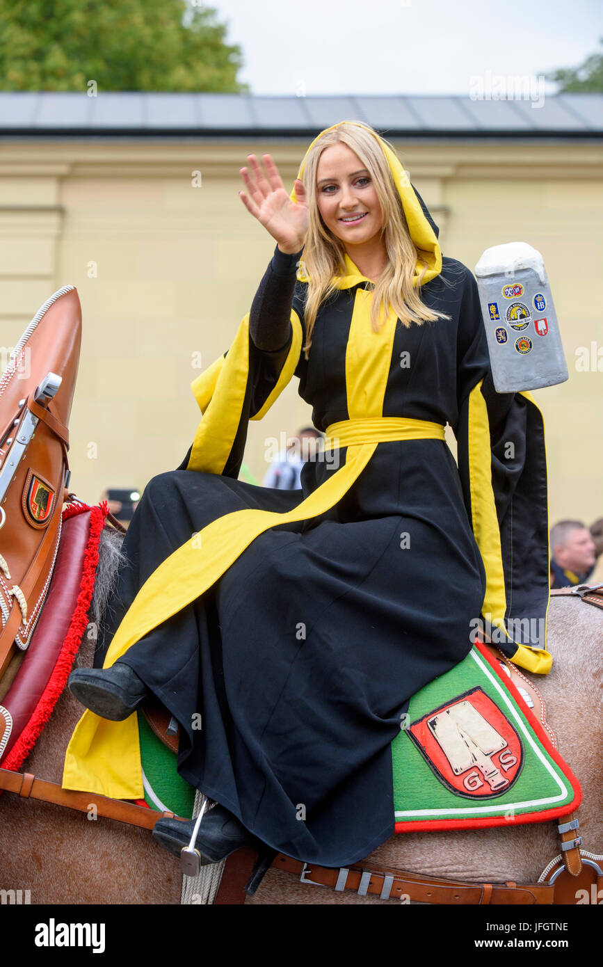 Oktoberfest in 2015 with traditional costumes and protection procession, the Munich Kindl (Laila Noeth) with a beer mug, Stock Photo