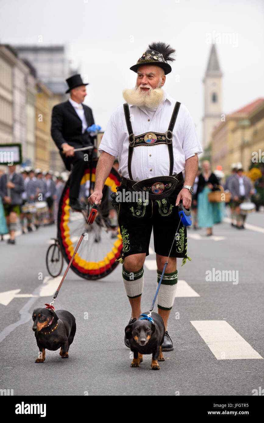 Oktoberfest in 2015 with traditional costumes and protection procession, an Urbayer with two dachshunds, Stock Photo