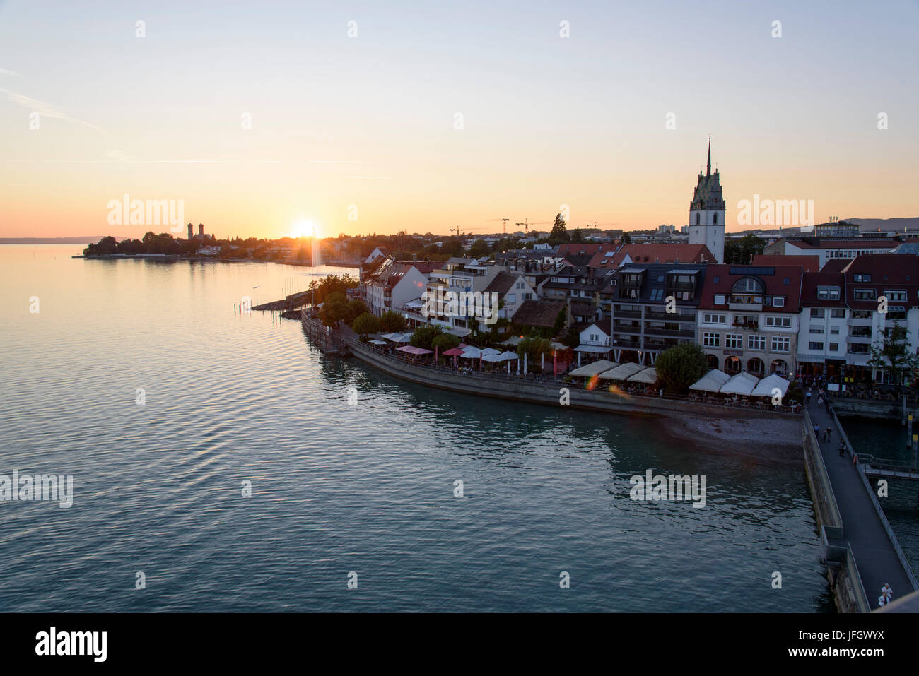 Town and lake at sundown, Friedrichshafen, Lake of Constance, Baden-Wurttemberg, Germany Stock Photo