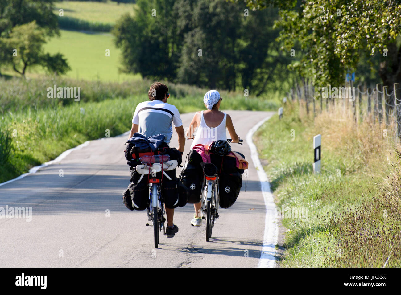 Cyclist on country road, peninsula Bodanrück, Lake of Constance, Baden-Wurttemberg, Germany Stock Photo
