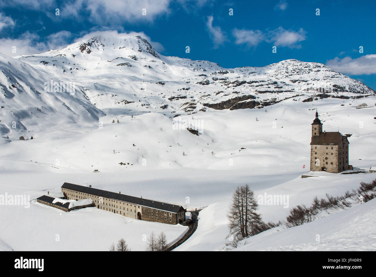 Winter scenery in the Simplonpass with old hospice, Valais, Switzerland Stock Photo