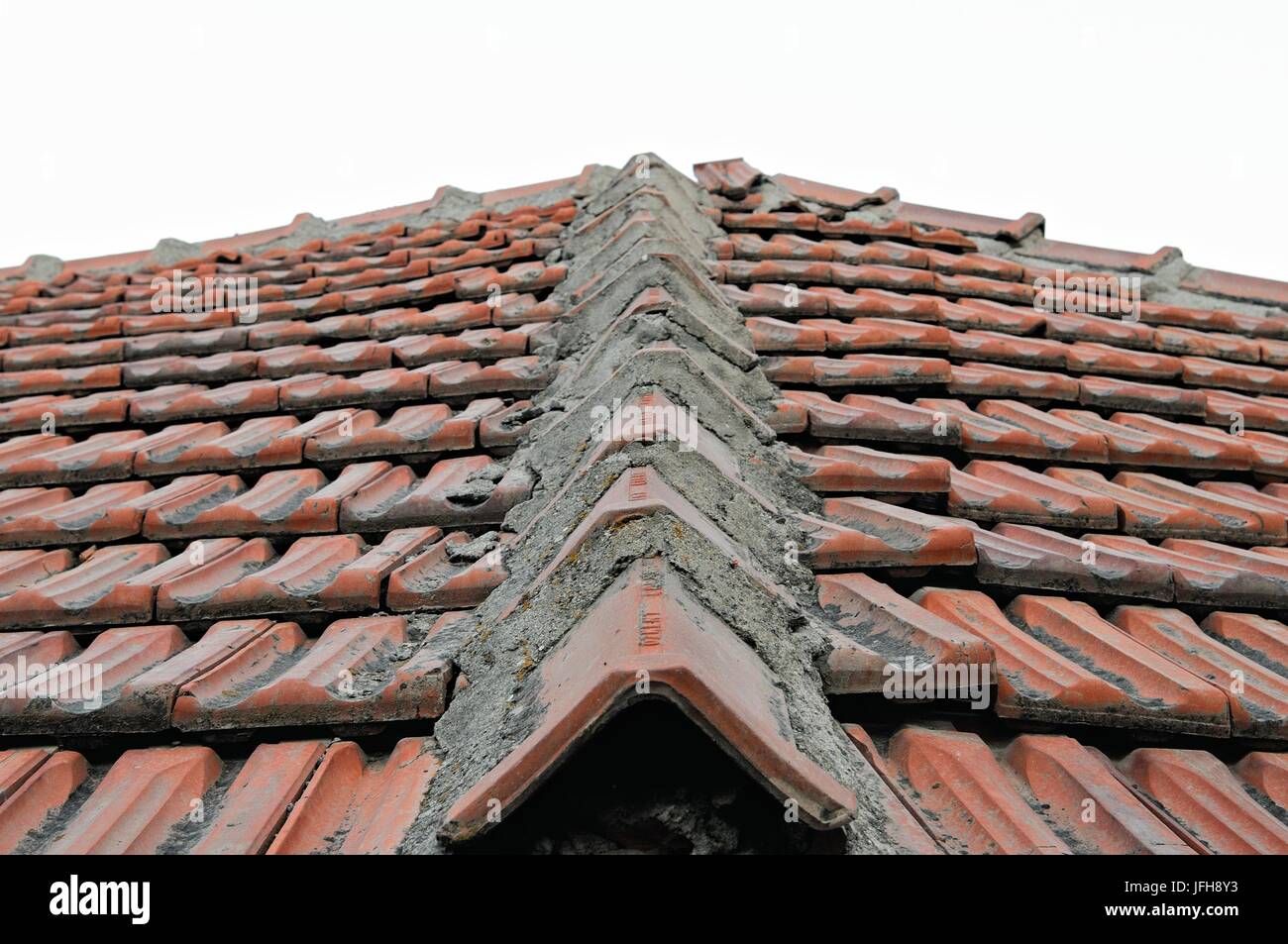 Old Folding roof with ridge tile Stock Photo