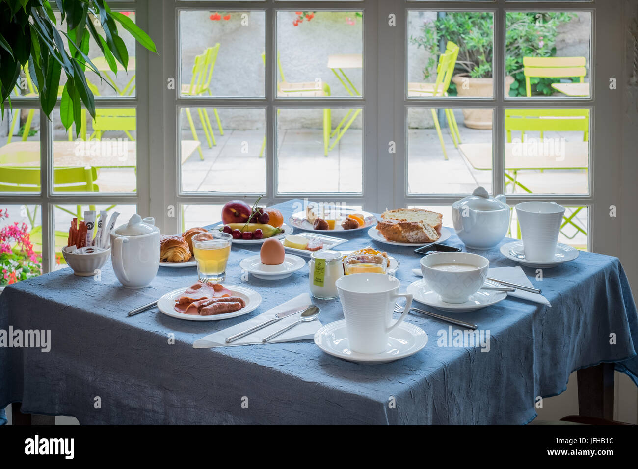 breakfast in bed near fire place Stock Photo Alamy