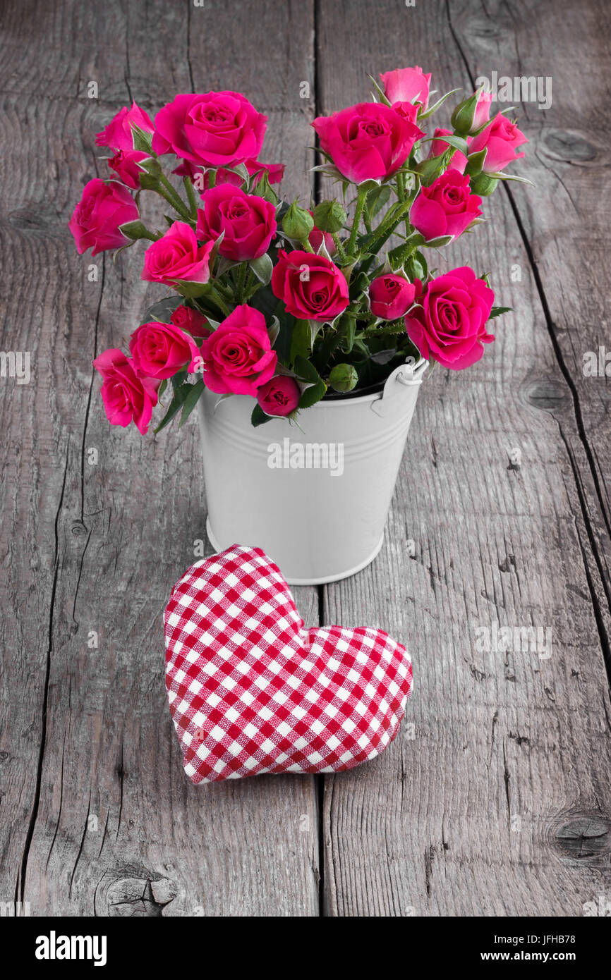 Bucket of pink roses Stock Photo Alamy