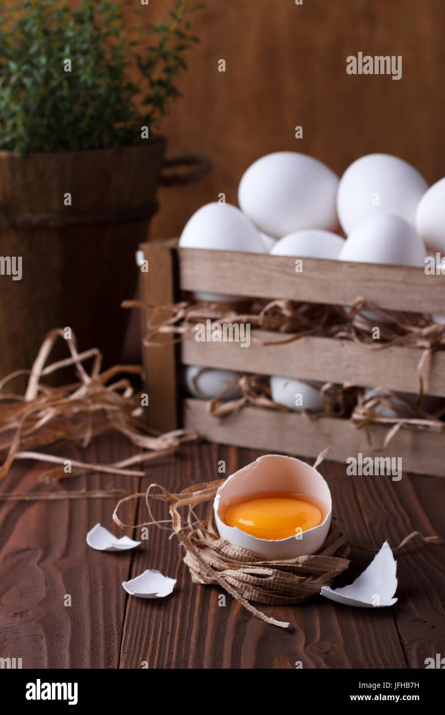 White eggs on brown wooden background Stock Photo