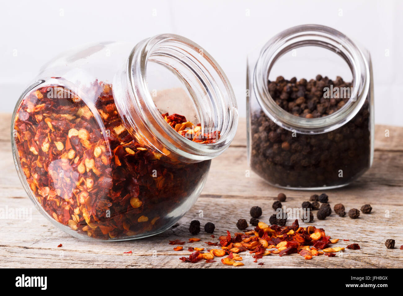 Chili flakes and black pepper Stock Photo Alamy