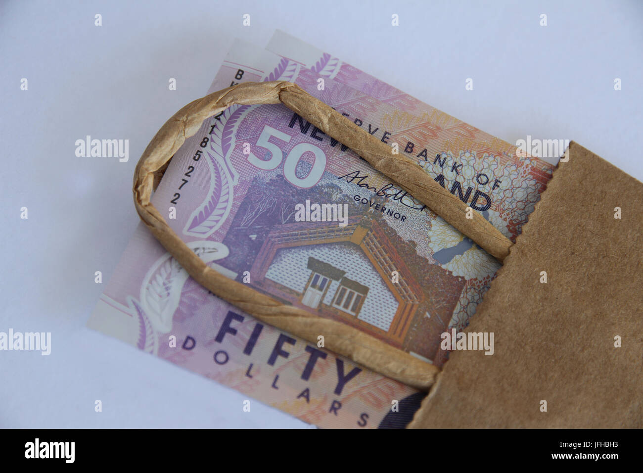 New Zealand fifty dollars in a brown paper bag Stock Photo Alamy