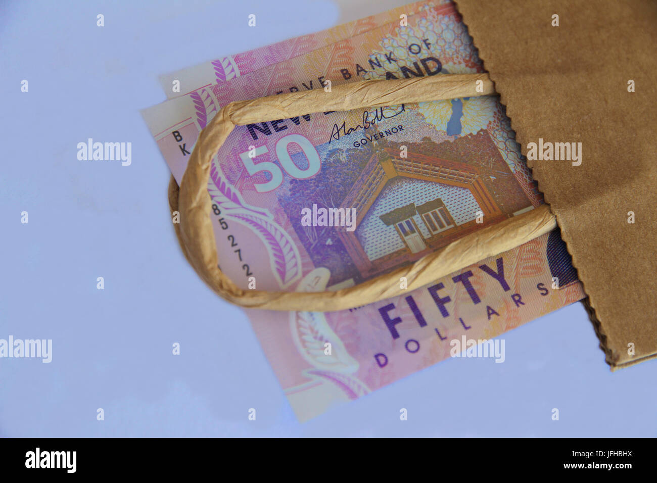 New Zealand fifty dollars in a brown paper bag Stock Photo Alamy