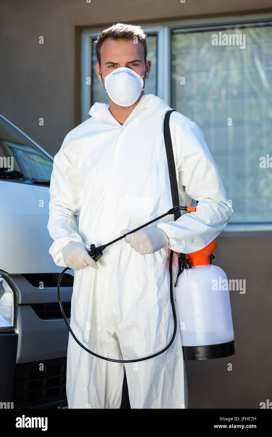 Portrait of pest control man standing next to a van Stock Photo Alamy