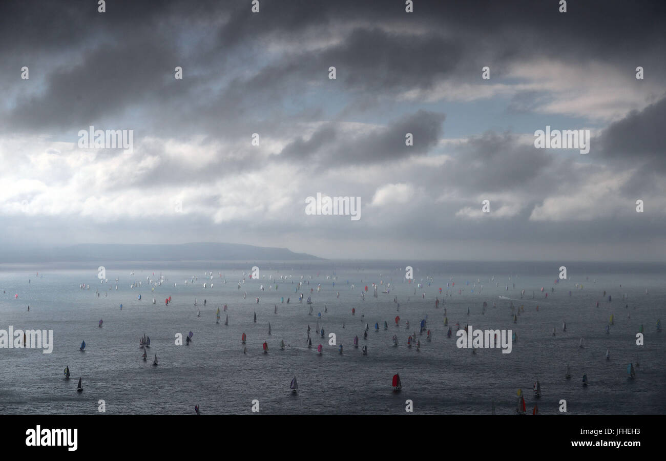 Hundreds of sailing boats make their way around the Isle of Wight close to the Needles as they take part in the 2017 Round the Island Race. Stock Photo