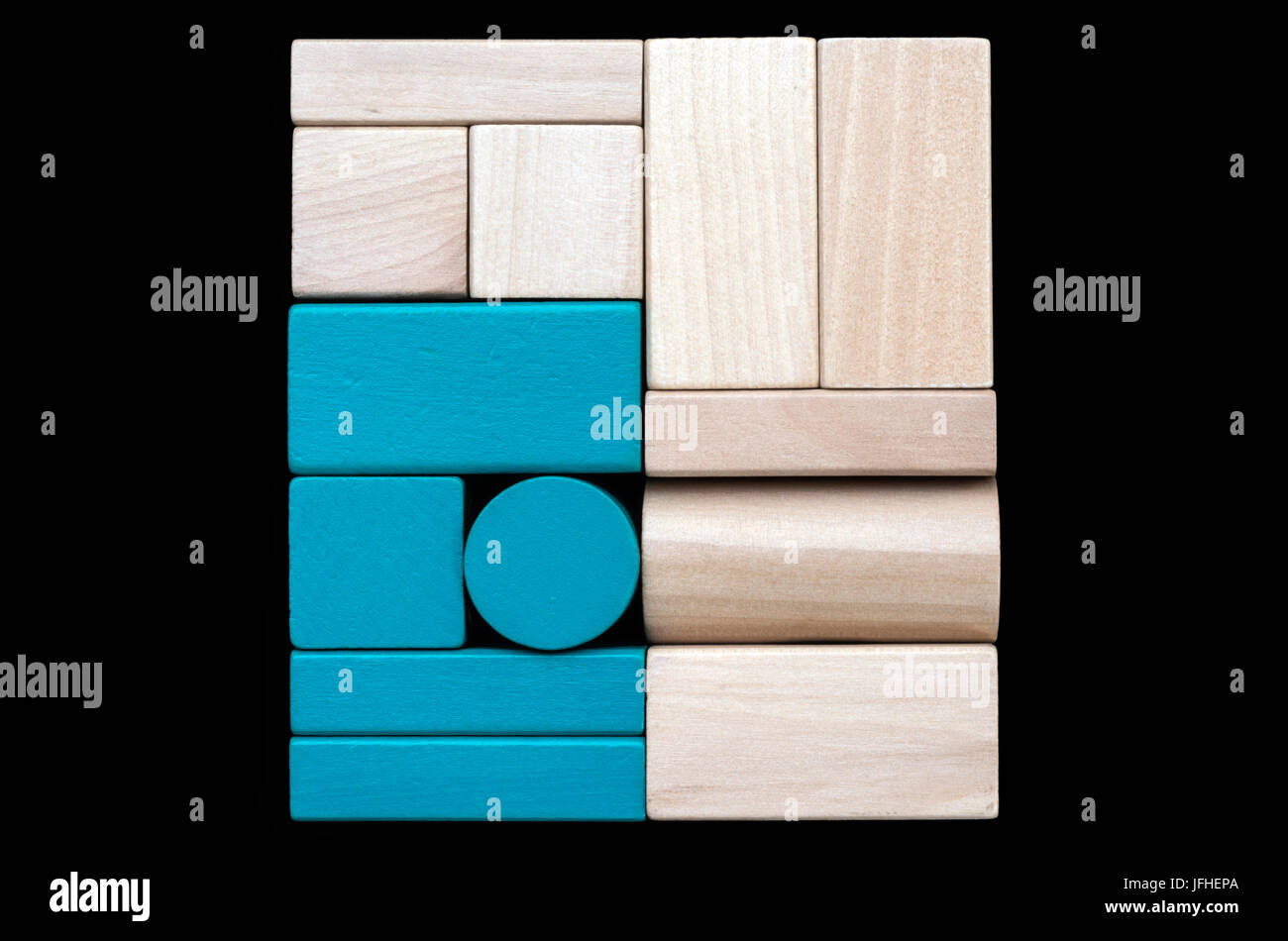 Minimalistic wooden blocks sorted on black background Stock Photo