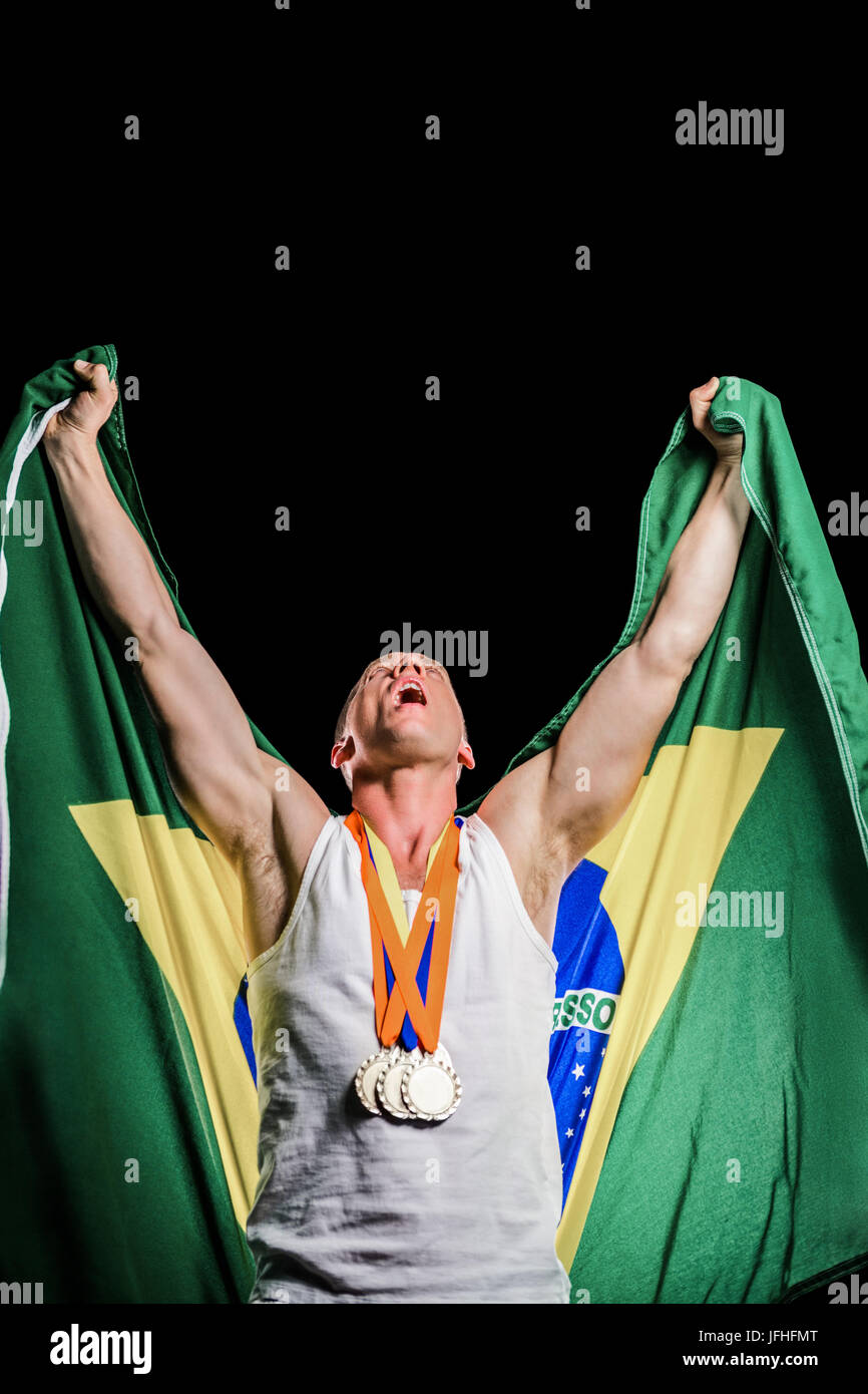 Athlete posing with gold medals after victory Stock Photo - Alamy