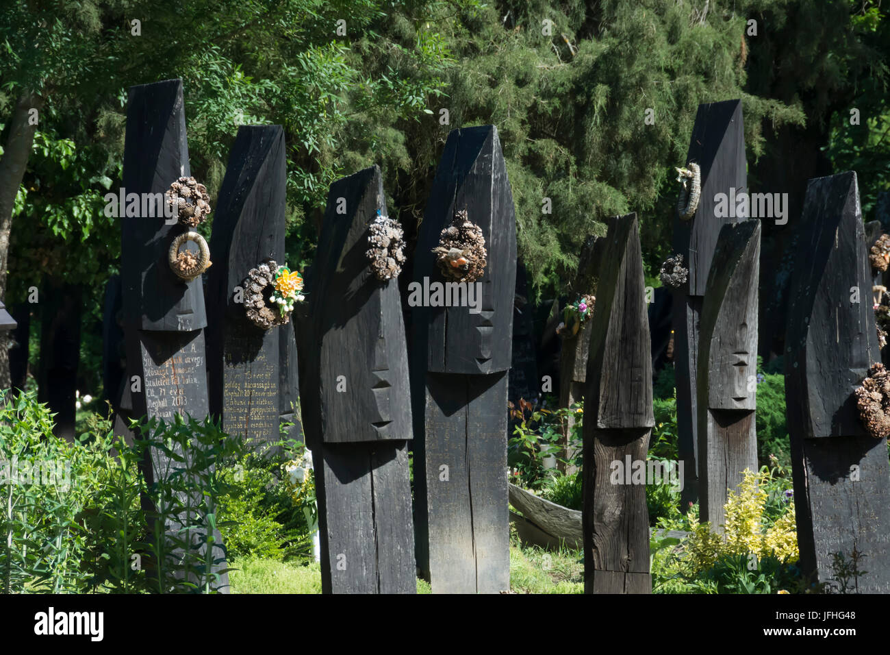 Szatmarczeke , Hungary. Wooden boat shaped gravestones on the cemetery Stock Photo