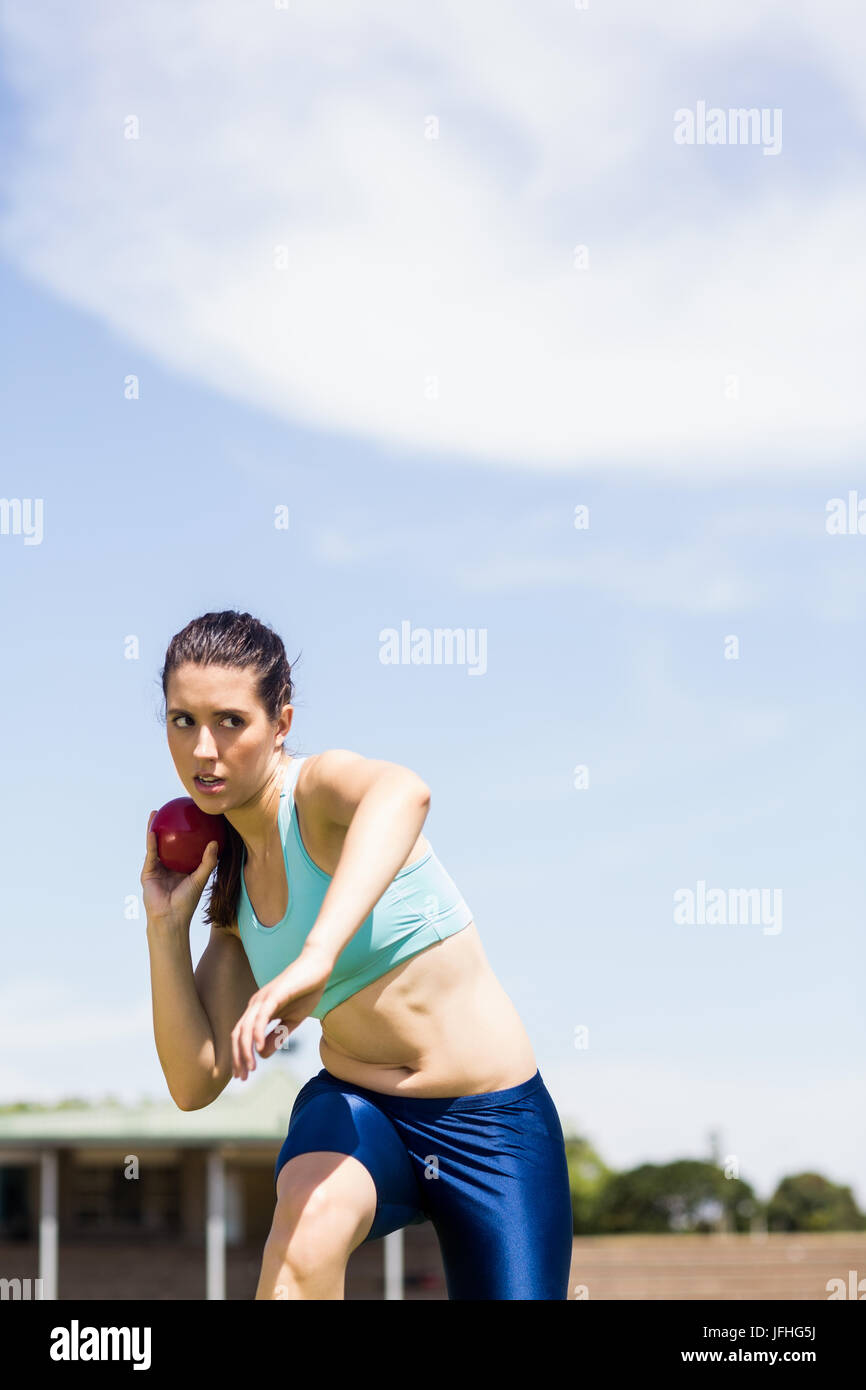 Female athlete preparing to throw shot put ball Stock Photo Alamy