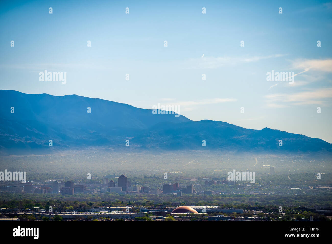 Albuquerque new mexico skyline in smog  with mountains Stock Photo
