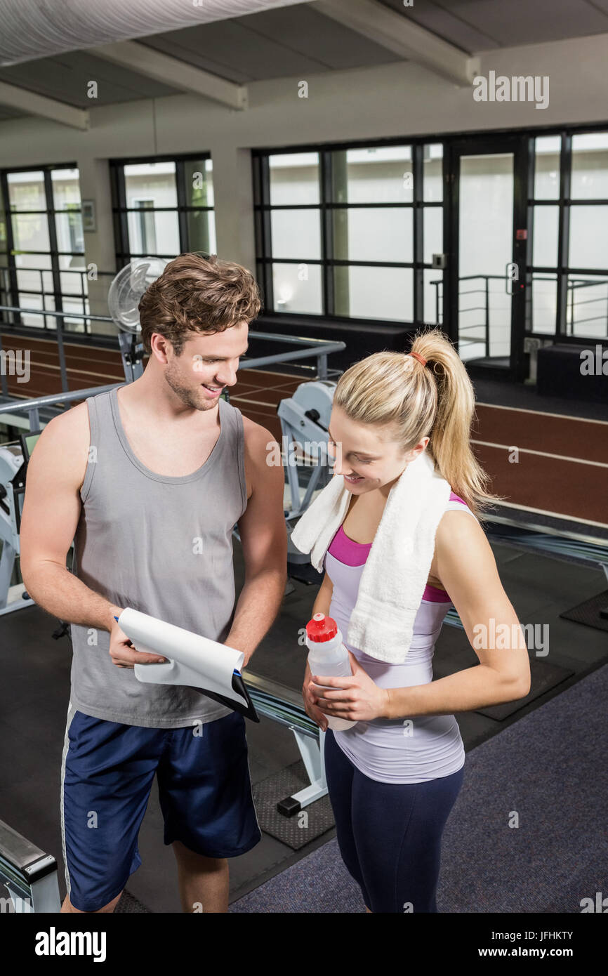 Woman and personal trainer talking hi-res stock photography and images ...