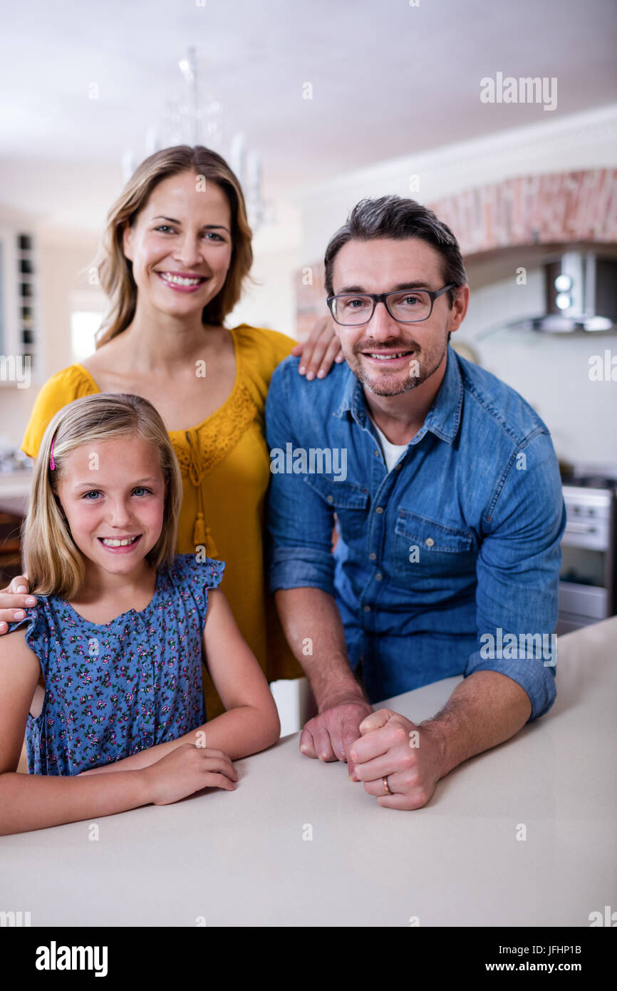 Portrait of happy parents and daughter in kitchen Stock Photo