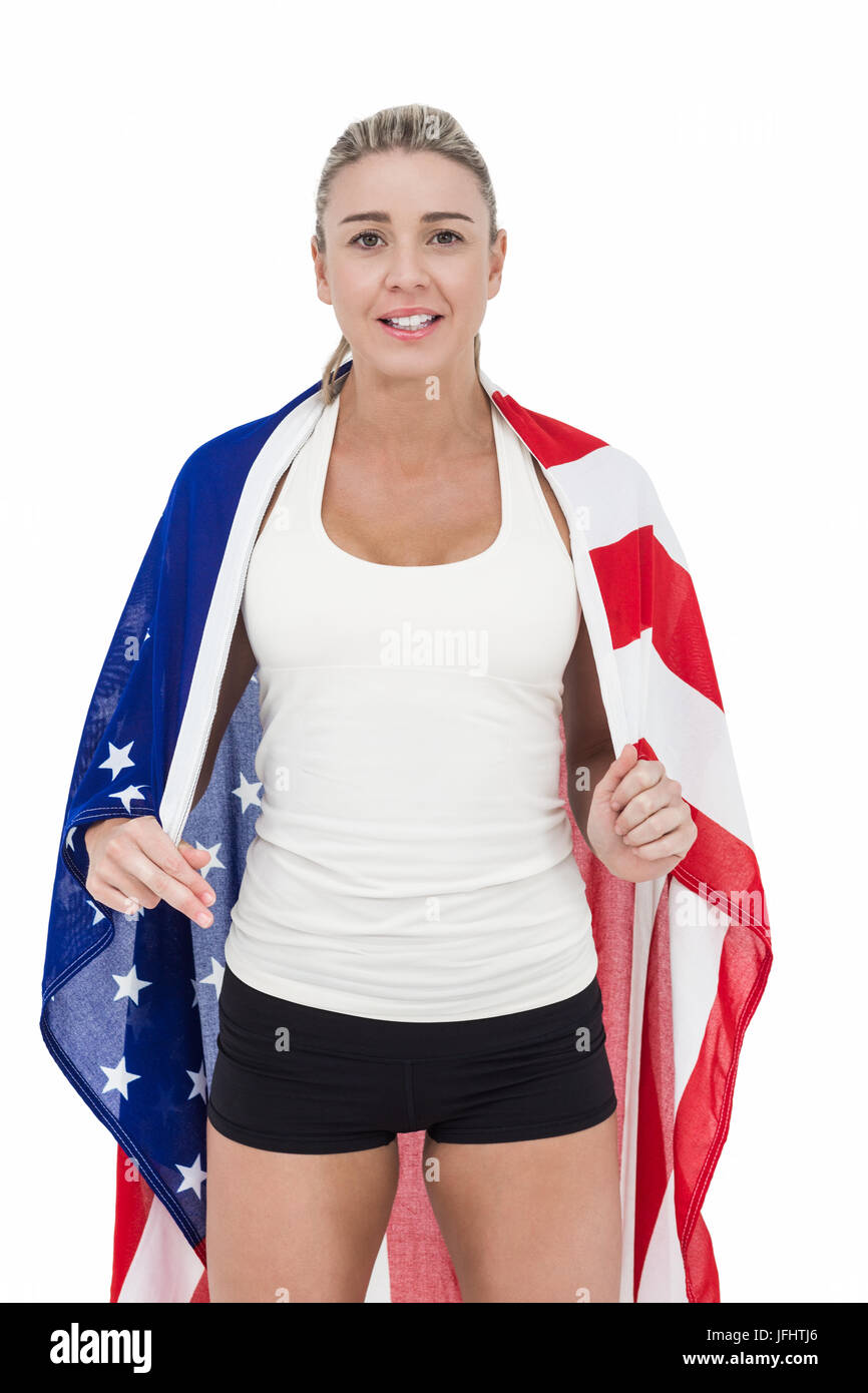 Female athlete with american flag on her shoulders Stock Photo