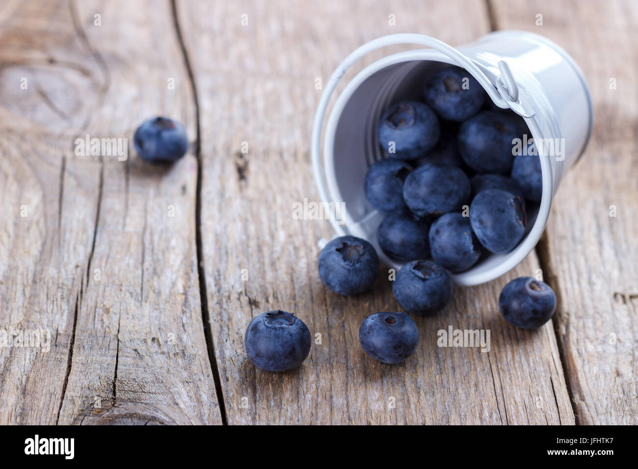 Ripe blueberries in a bucket Stock Photo - Alamy