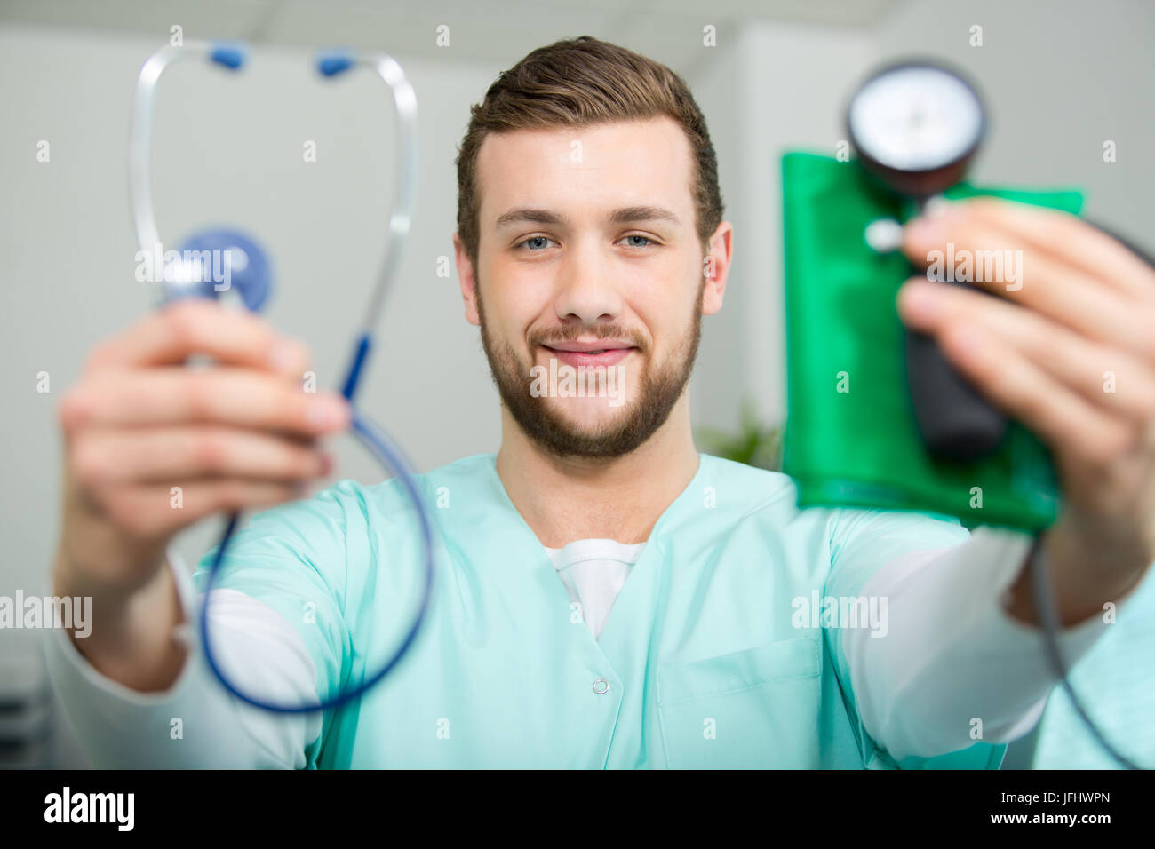 medic showing stethoscope and blood pressure testing kit Stock Photo