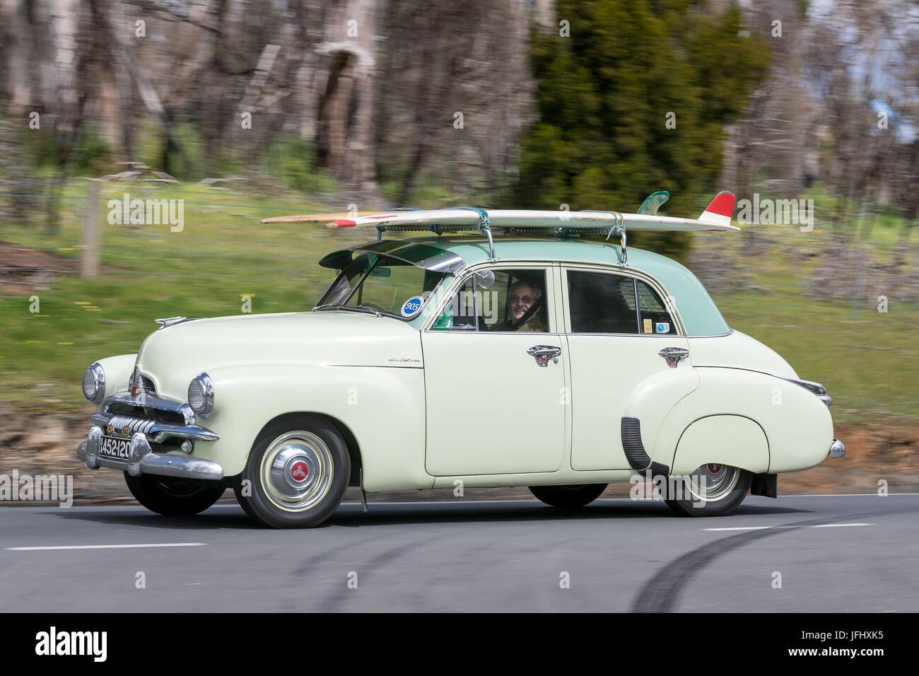 Vintage 1955 Holden FJ Sedan driving on country roads near the town of Birdwood, South Australia. Stock Photo