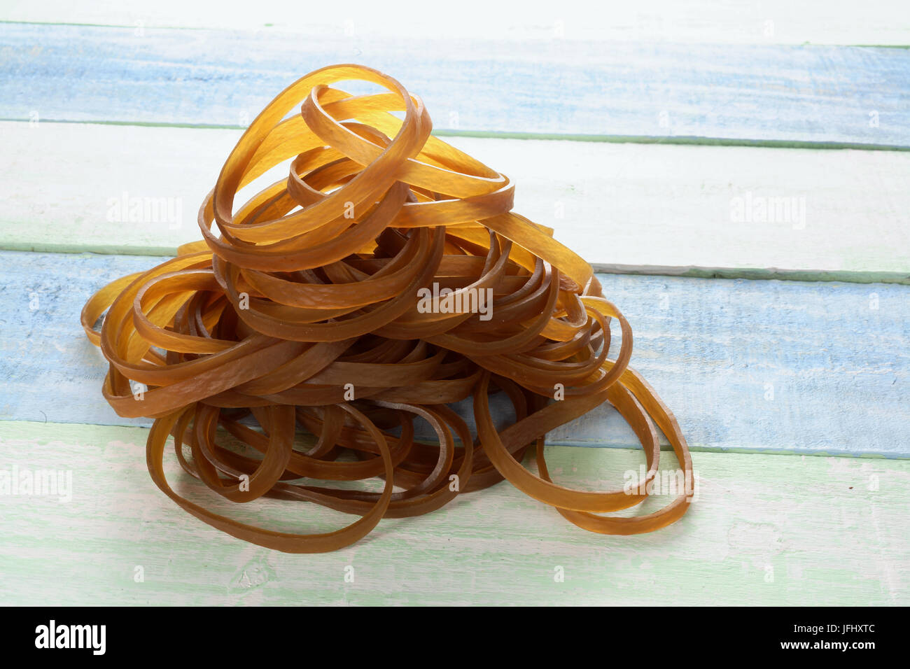 Rubber Bands on Wooden Background Stock Photo