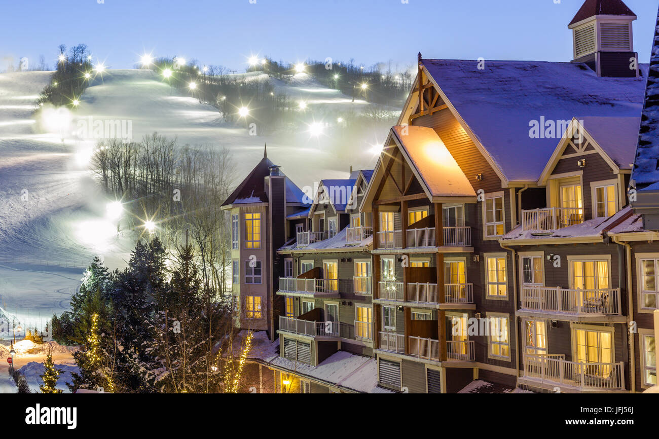 blue-mountain-village-in-winter-with-mountain-background-stock-photo