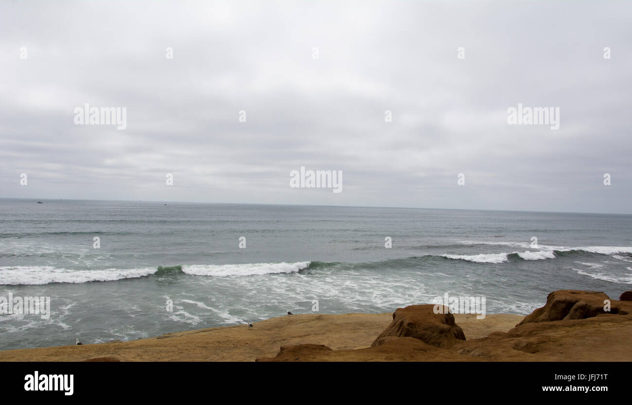 A cloudy and very overcast day on a beach Stock Photo