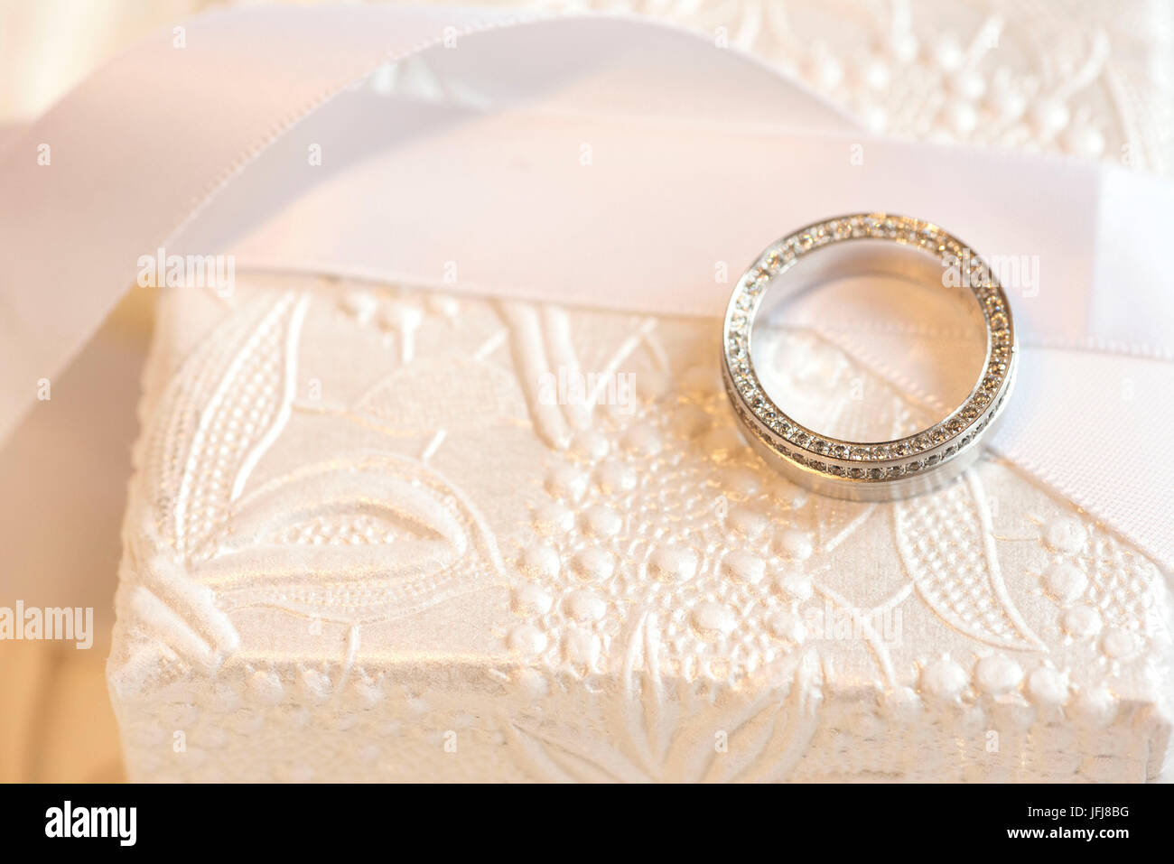 Ring made of platinum with diamonds on a white box Stock Photo