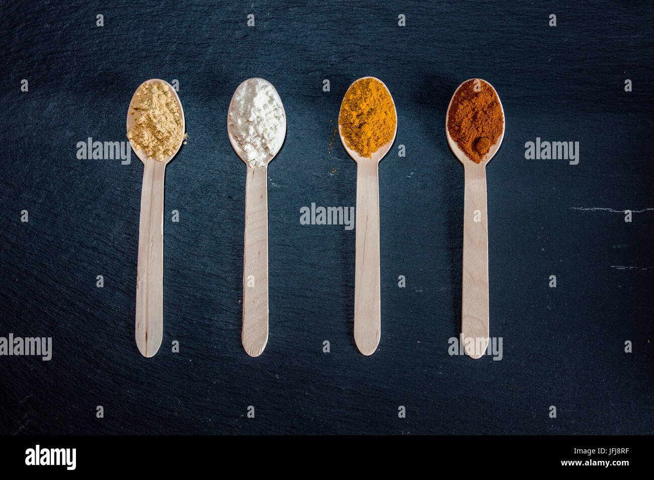 Local spices and aromas of Italian cooking stored in spoons Stock Photo