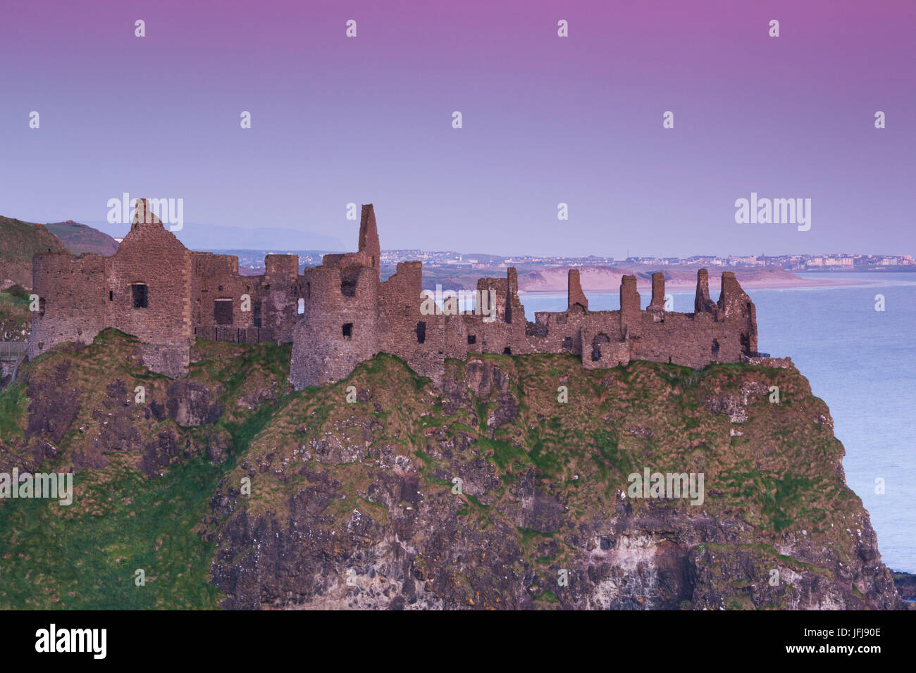 UK, Northern Ireland, County Antrim, Bushmills, Dunluce Castle ruins, dawn Stock Photo