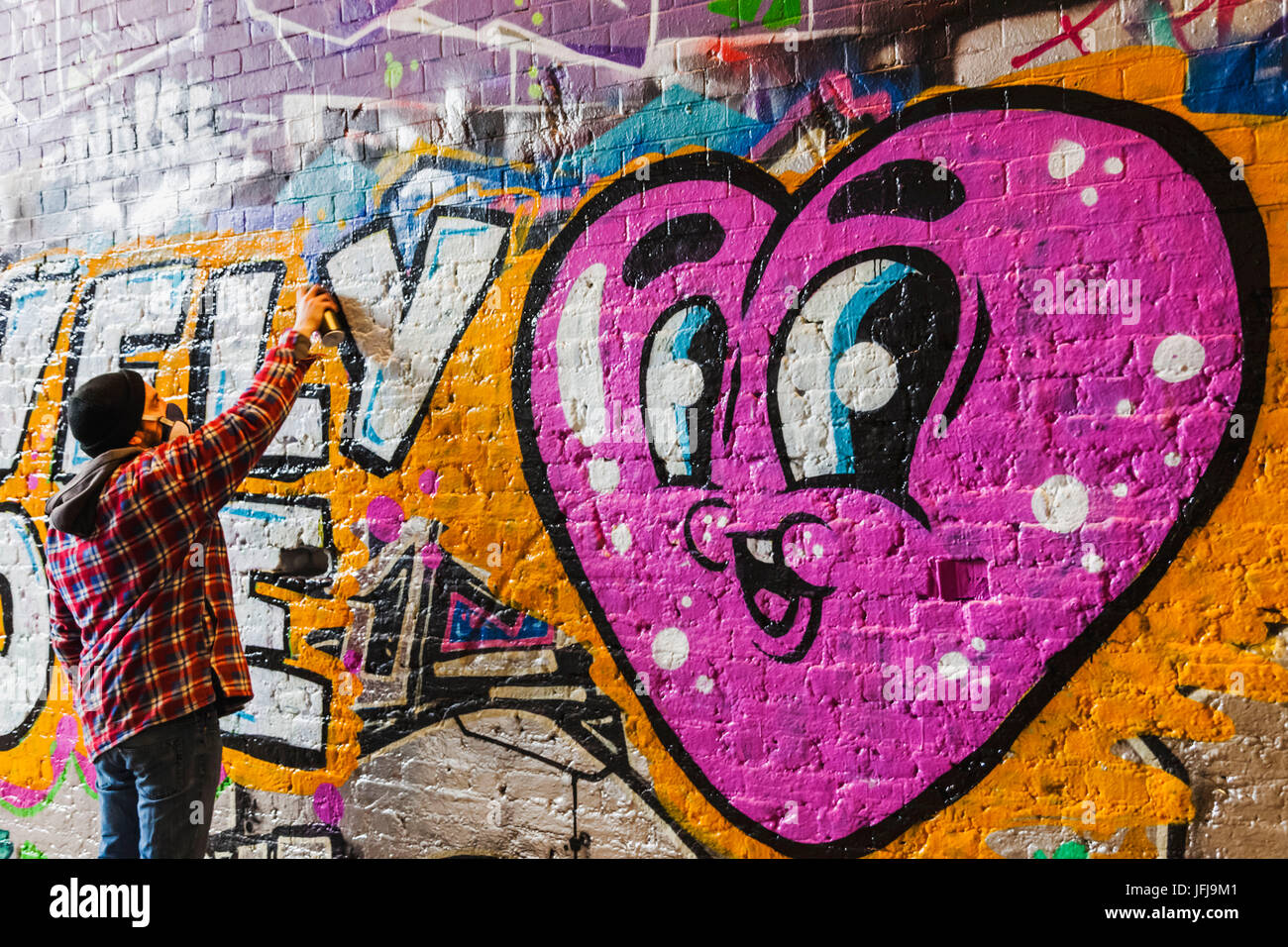 England, London, Lambeth, Waterloo, Leake Street, Graffiti and Wall Art Tunnel, Street Art with Words Lovely Love and Heart Stock Photo