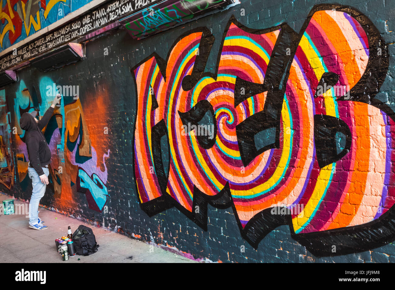 England, London, Lambeth, Waterloo, Leake Street, Graffiti and Wall Art Tunnel, Graffiti Artist at Work Stock Photo