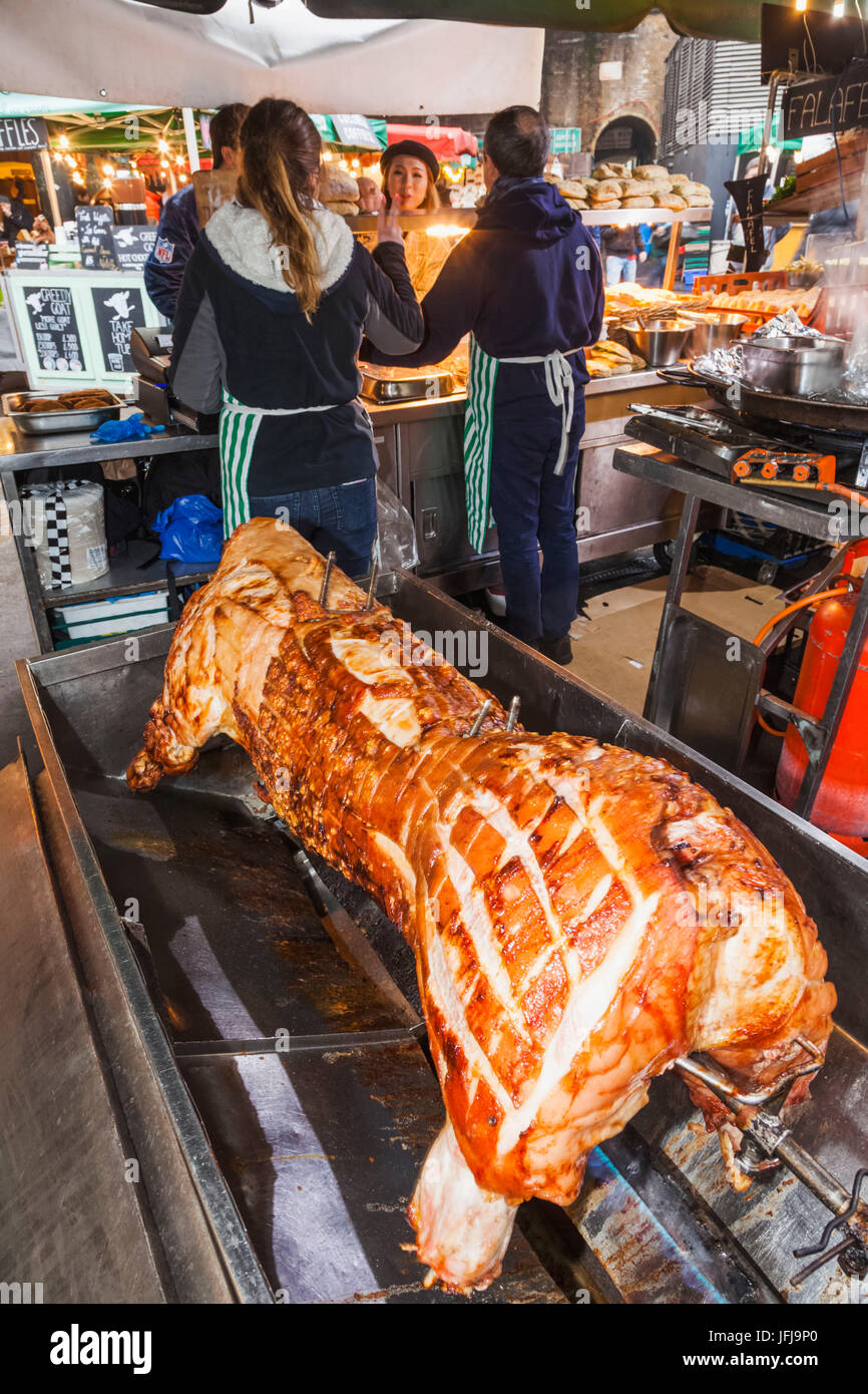 England, London, Southwark, Borough Market, Food Stall, Hog Roast Cooking on Spit Stock Photo