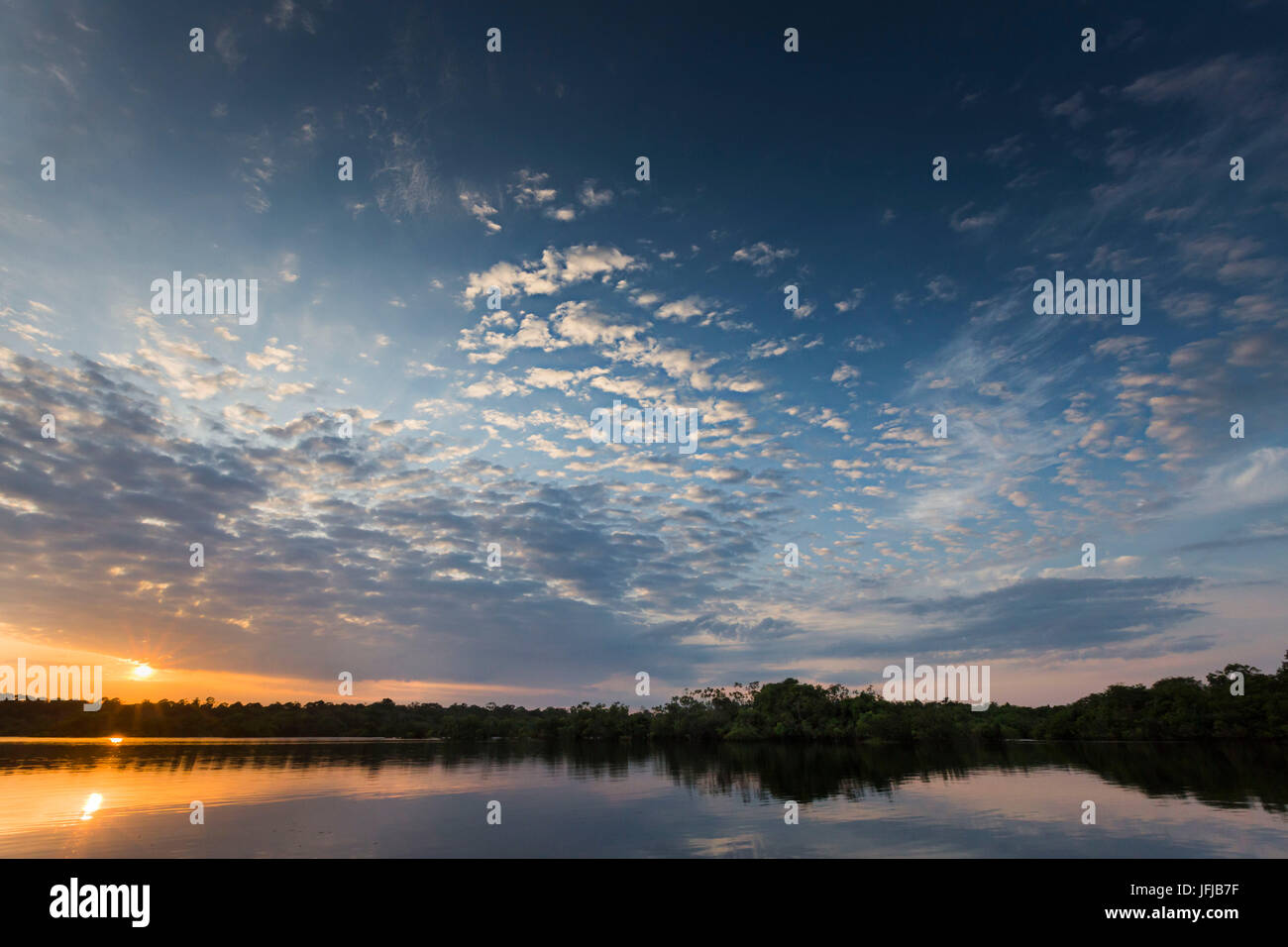 The rio negro waters depicted at sunrise, with stunning sky, Rio Negro, Amazonas, Amazonia, Manaus, Brazil, South America, Stock Photo