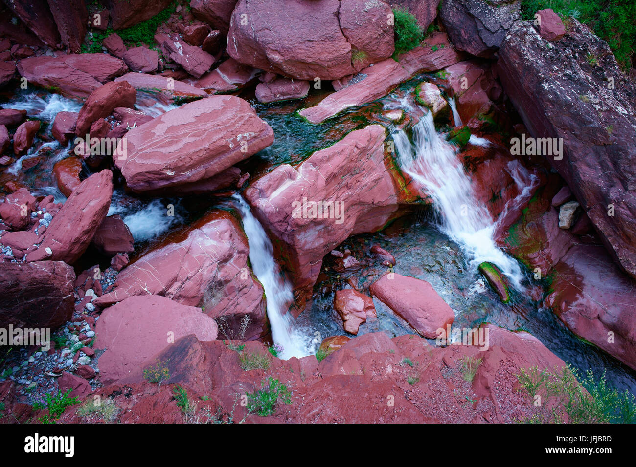 Waterfall on the Cians River in the Cians Gorge which is known for its distinctive red rock. Beuil, French Riviera's backcountry, France. Stock Photo