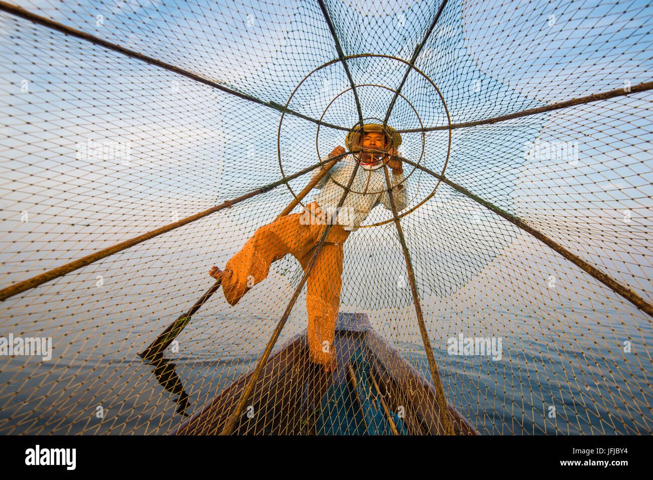 Inle lake, Nyaungshwe, Shan state, Myanmar, Fisherman looking through the fishing net, Stock Photo