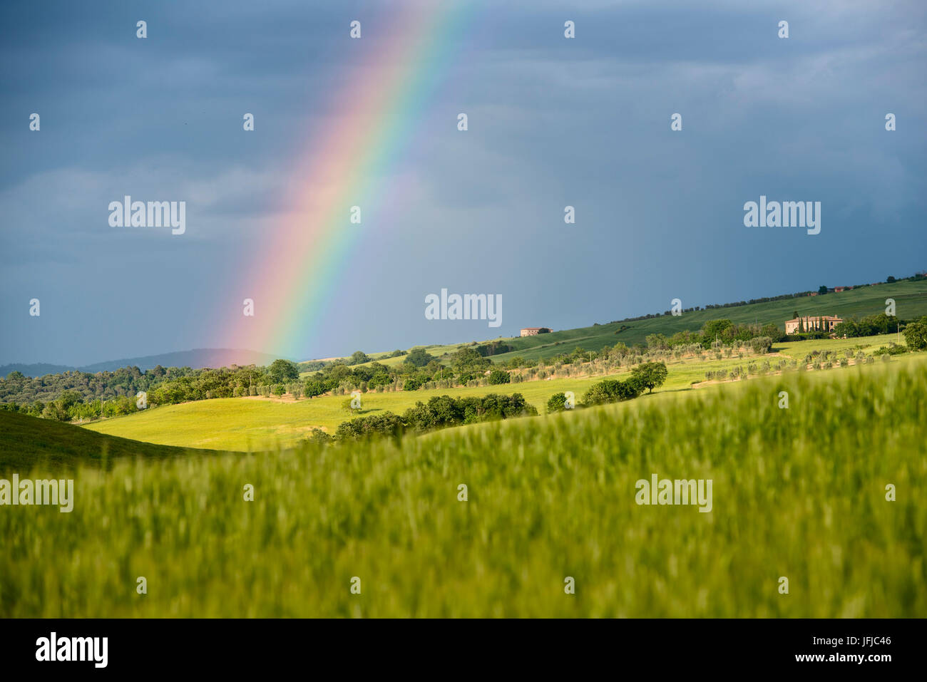 Italy, Tuscany, Siena District, Orcia Valley - rainbow after the storm Stock Photo