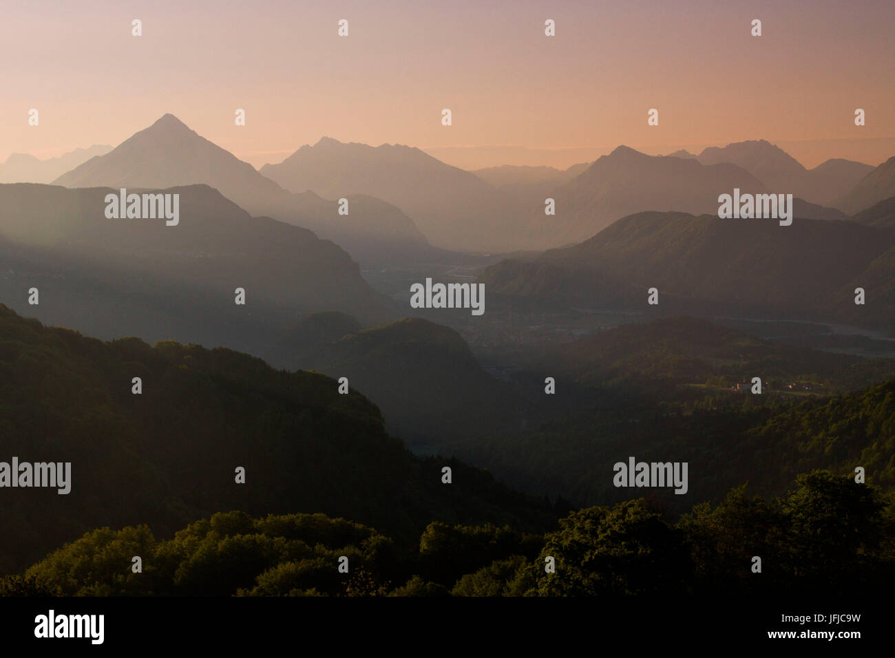 Europe, Italy, Friuli, Udine, The mountains of Carnia with their profiles seen from the plateau of Pani at dawn Stock Photo