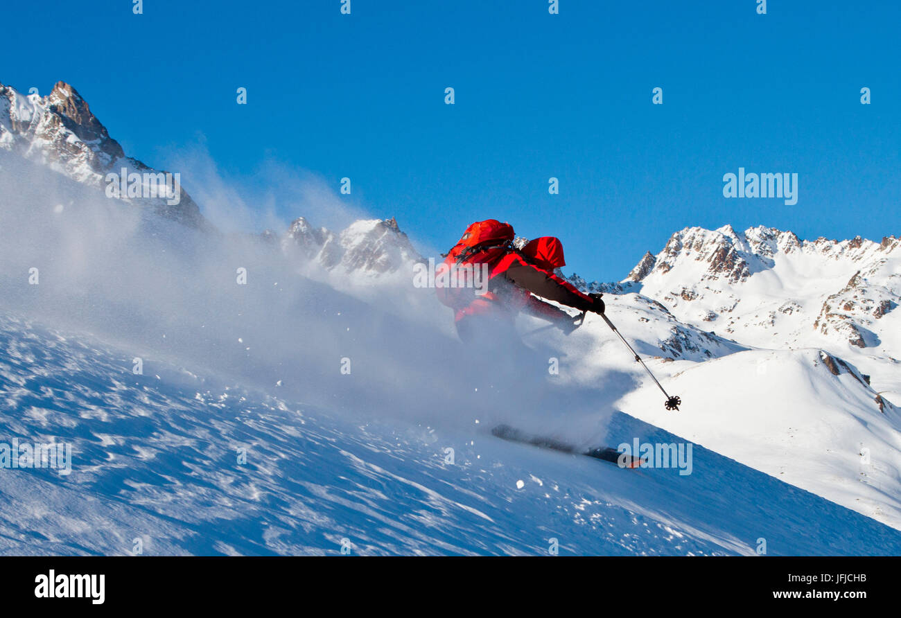Ski touring between the snowy and powdering slopes of Engadine - Switzerland Stock Photo