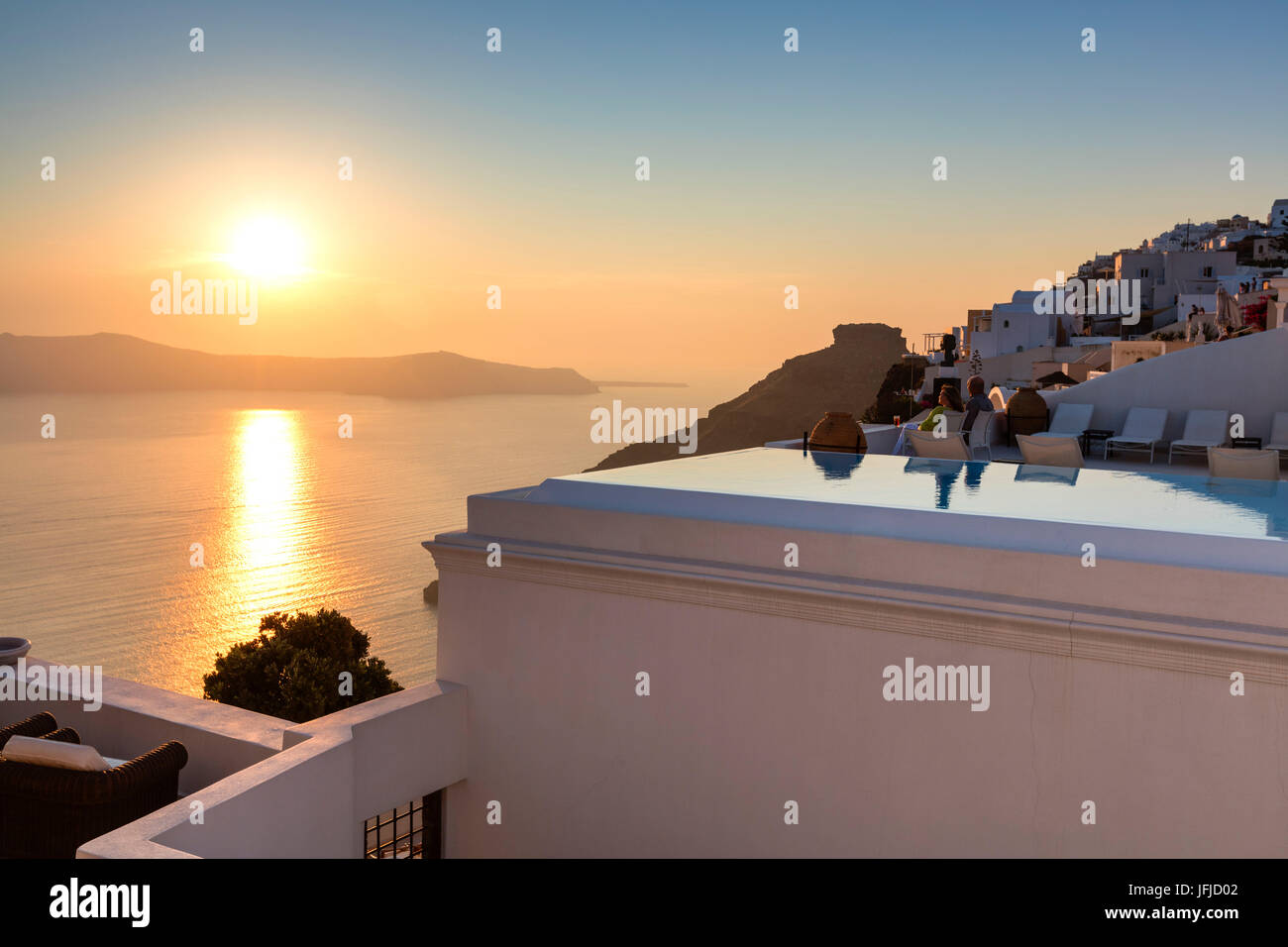 Sunset over the Aegean Sea seen from the old village of Firostefani Santorini Cyclades Greece Europe Stock Photo