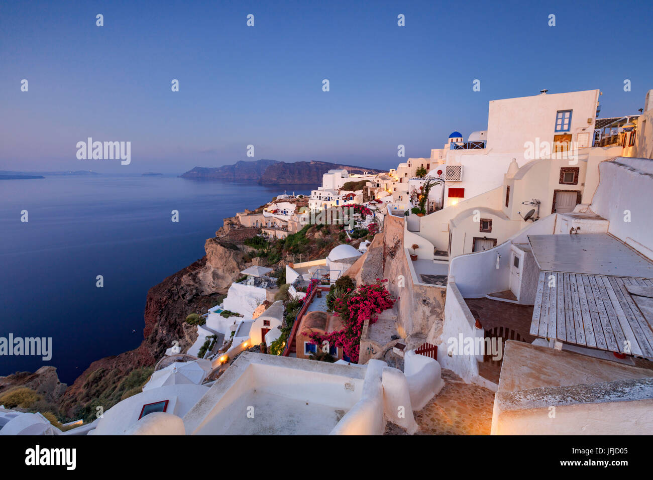 View of the Aegean Sea from the typical greek village of Oia at dusk Santorini Cyclades Greece Europe Stock Photo