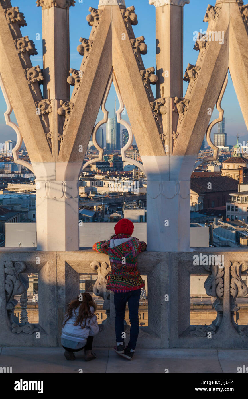 Milan, Lombardy, Italy, Two children observed the Milano's skyline from Cathedral's terrace Stock Photo