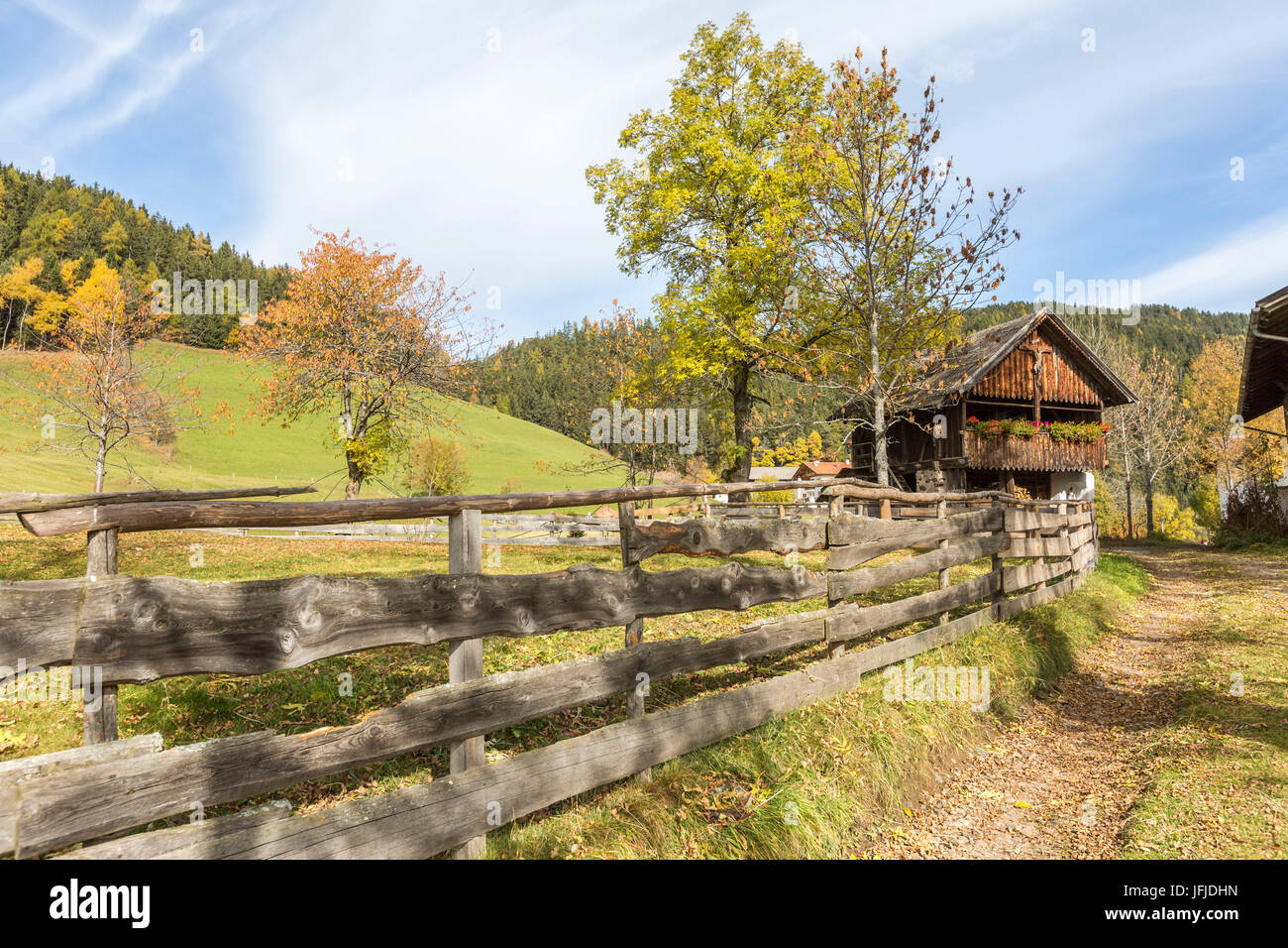Autumnal scenery with mountain lodge and fence, Santa Maddalena, Funes, Bolzano, Trentino Alto Adige - Sudtirol, Italy, Europe, Stock Photo