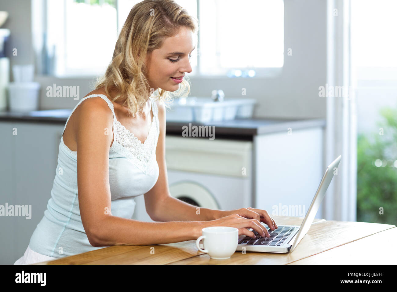 Beautiful woman working on laptop Stock Photo - Alamy